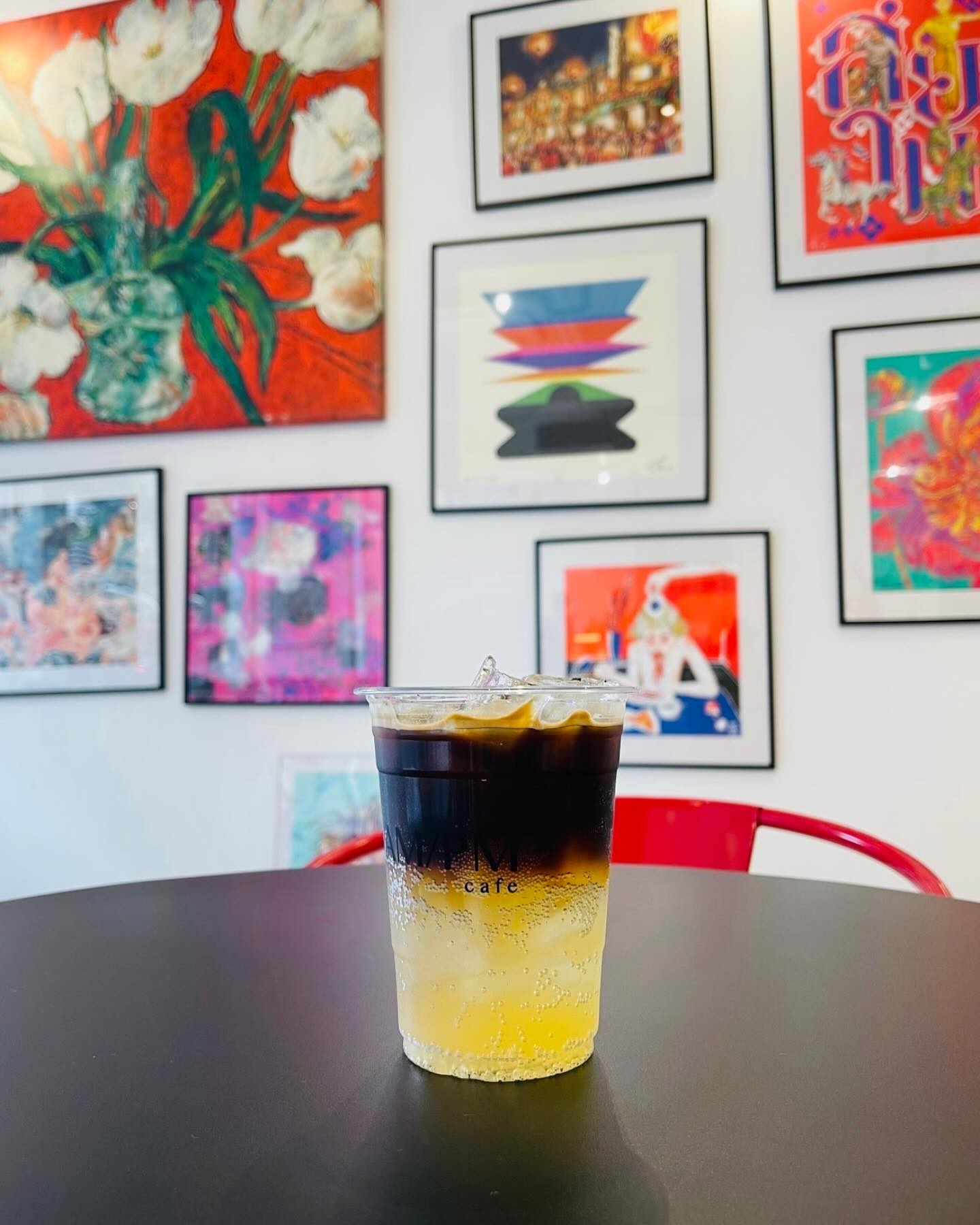 Drink with art wall at AmPm Ari Cafe
