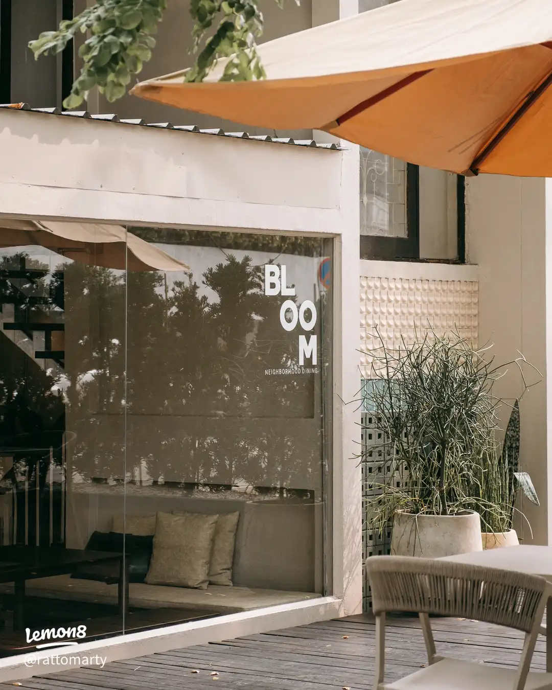 Bloom Dining window logo and terrace umbrella