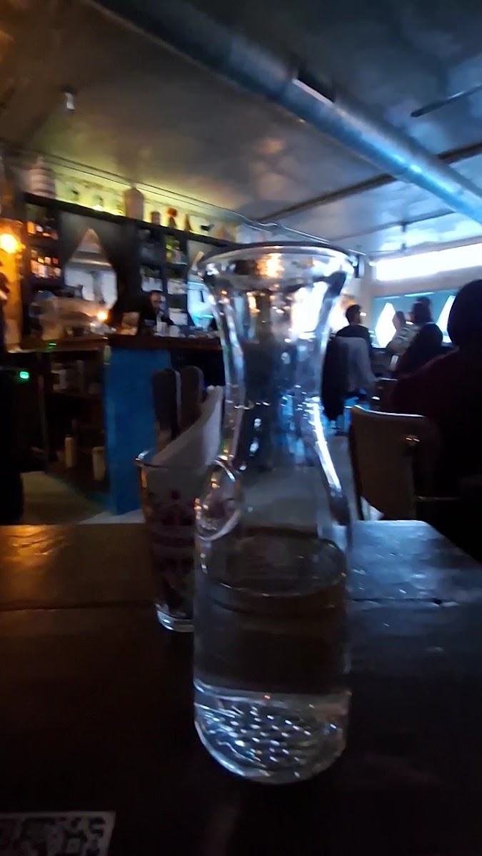 Glassware and dim bar atmosphere