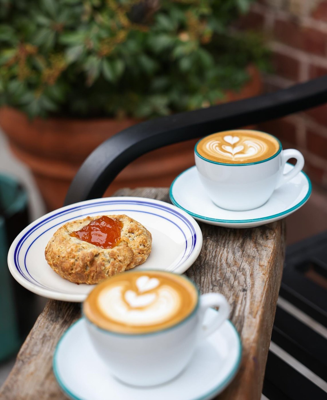 Two coffee drinks outside Ost Cafe