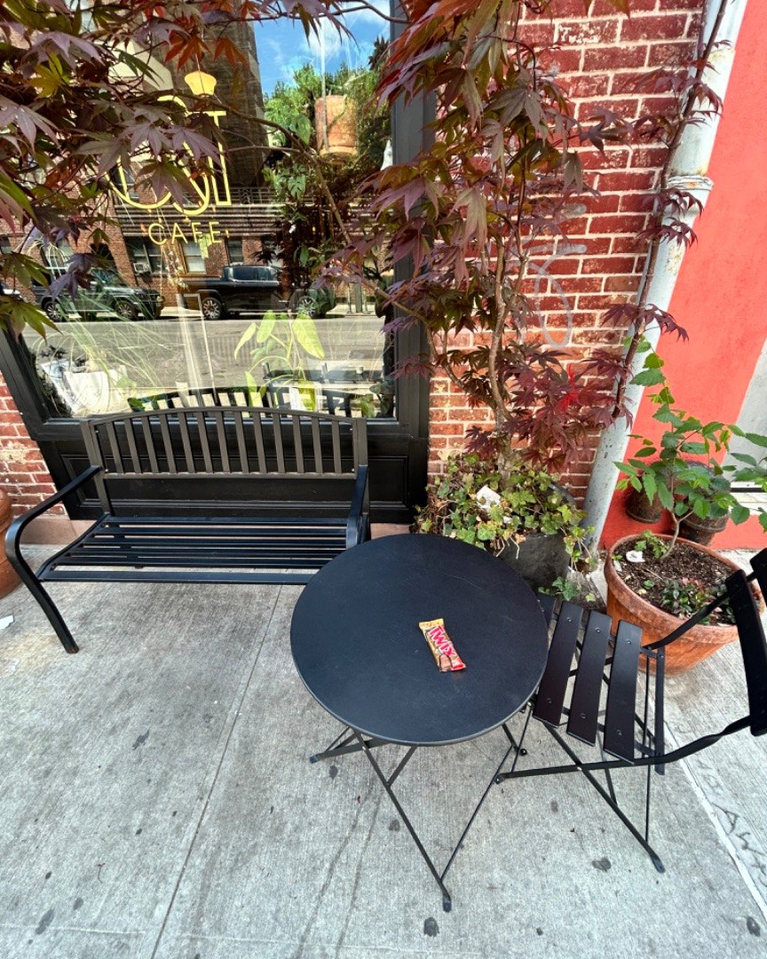 Outdoor table and plants at Ost Cafe